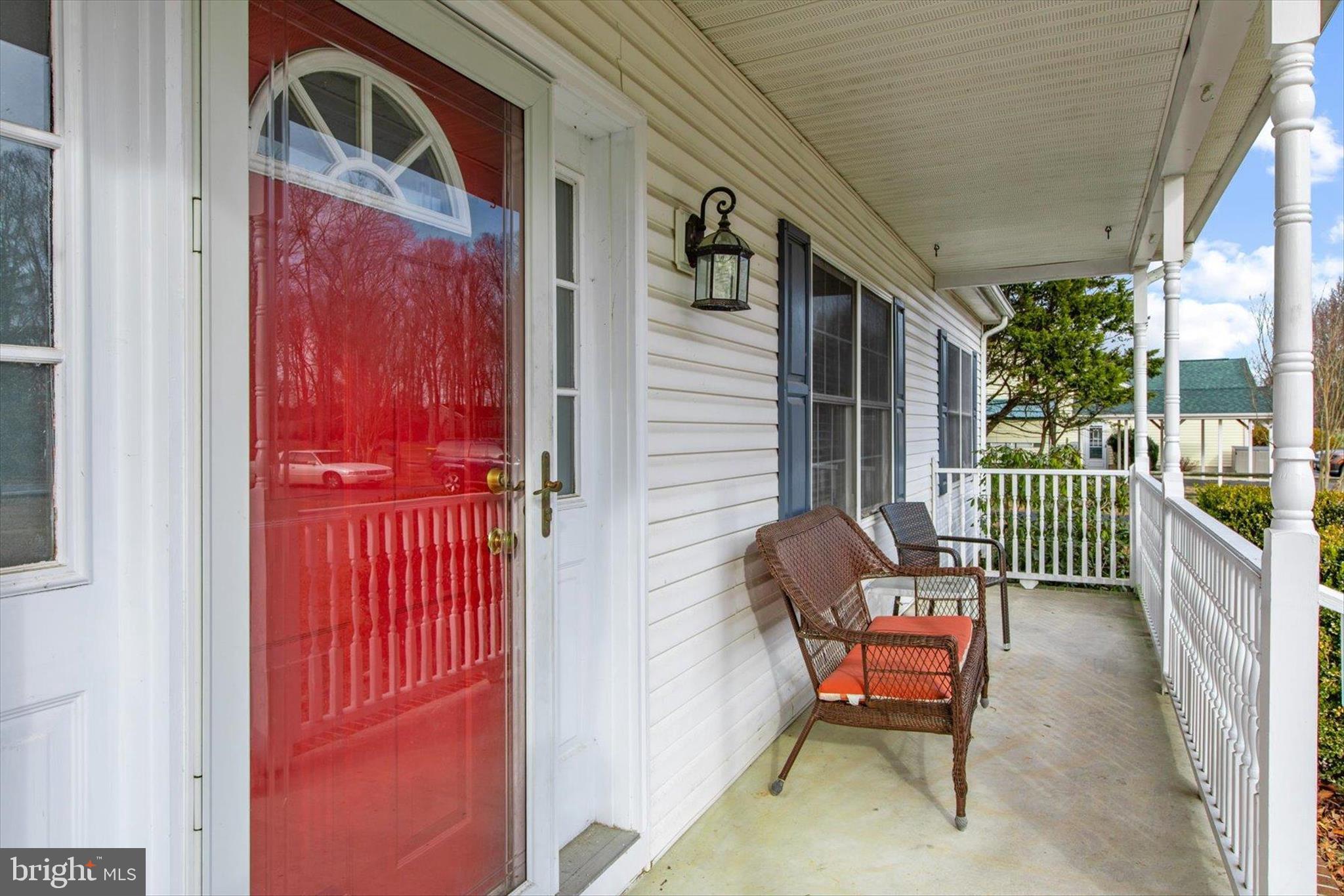 24618 Peterkins Road Georgetown, DE 19947 - Photo 5 of 47 a porch with a bench