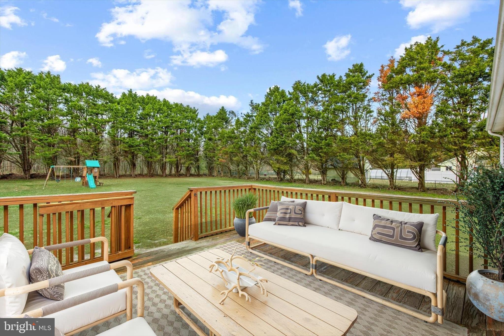 24618 Peterkins Road Georgetown, DE 19947 - Photo 6 of 47 a view of deck with couches and wooden floor