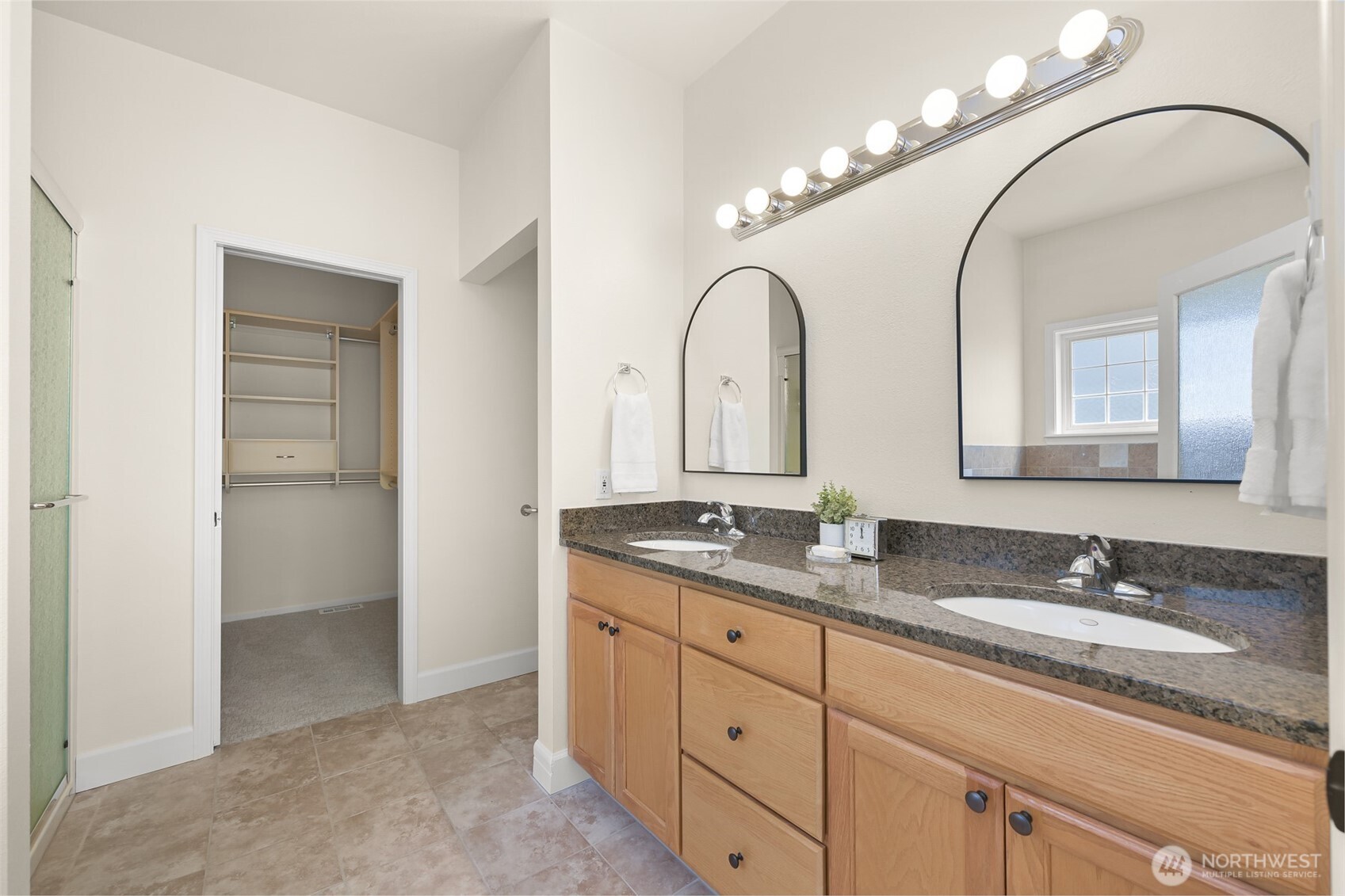 500 Fieldstone Loop, Unit 14 Lynden, WA 98264 - Photo 16 of 25 a en suite bathroom with a granite countertop double vanity sink and a mirror