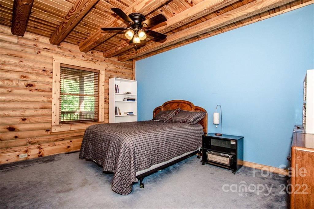 133 Folkstone Road, Unit 2 Mooresville, NC 28117 - Photo 21 of 32 a bedroom with a bed and a window