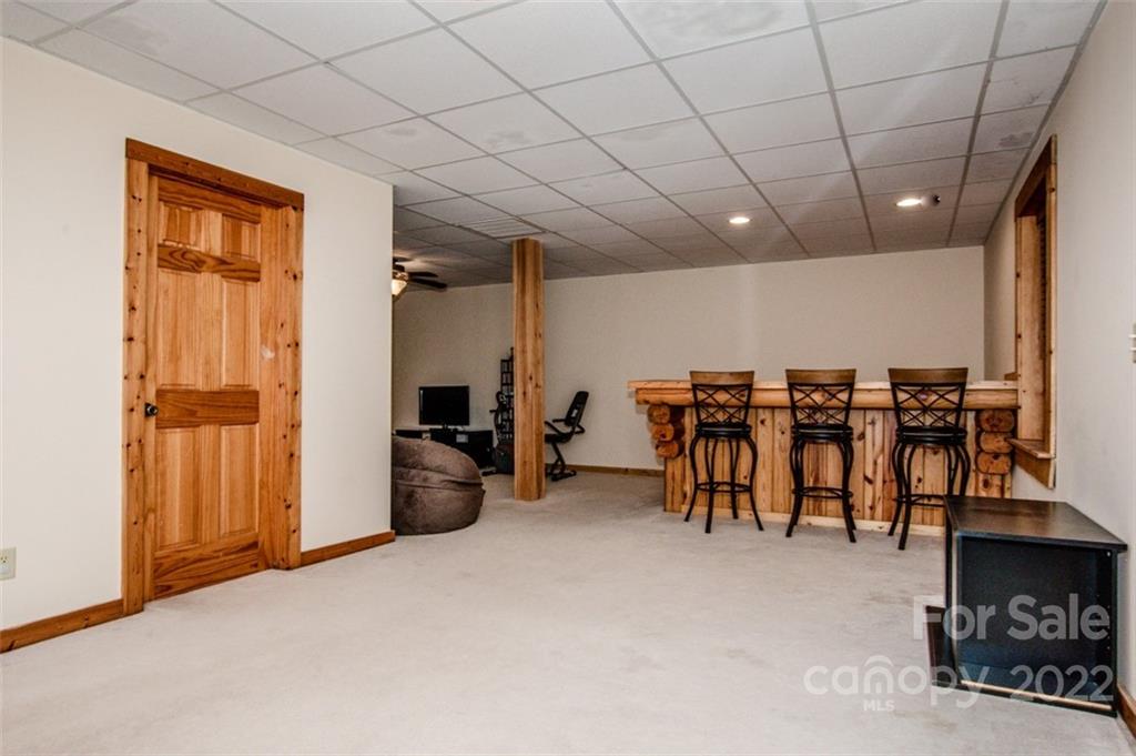 133 Folkstone Road, Unit 2 Mooresville, NC 28117 - Photo 23 of 32 a view of a livingroom with furniture and a garage