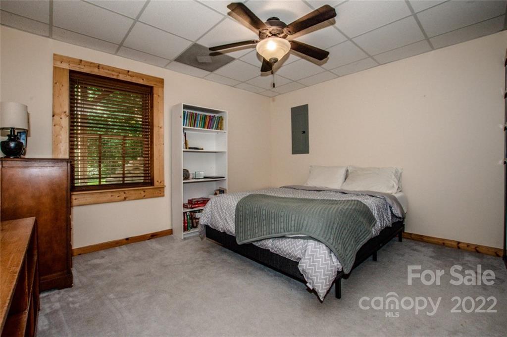 133 Folkstone Road, Unit 2 Mooresville, NC 28117 - Photo 25 of 32 a spacious bedroom with a bed and a large window