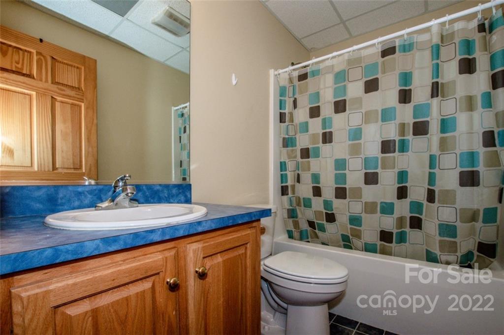 133 Folkstone Road, Unit 2 Mooresville, NC 28117 - Photo 26 of 32 a bathroom with a sink toilet and shower