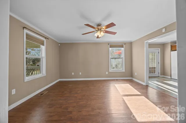 a view of an empty room with a window