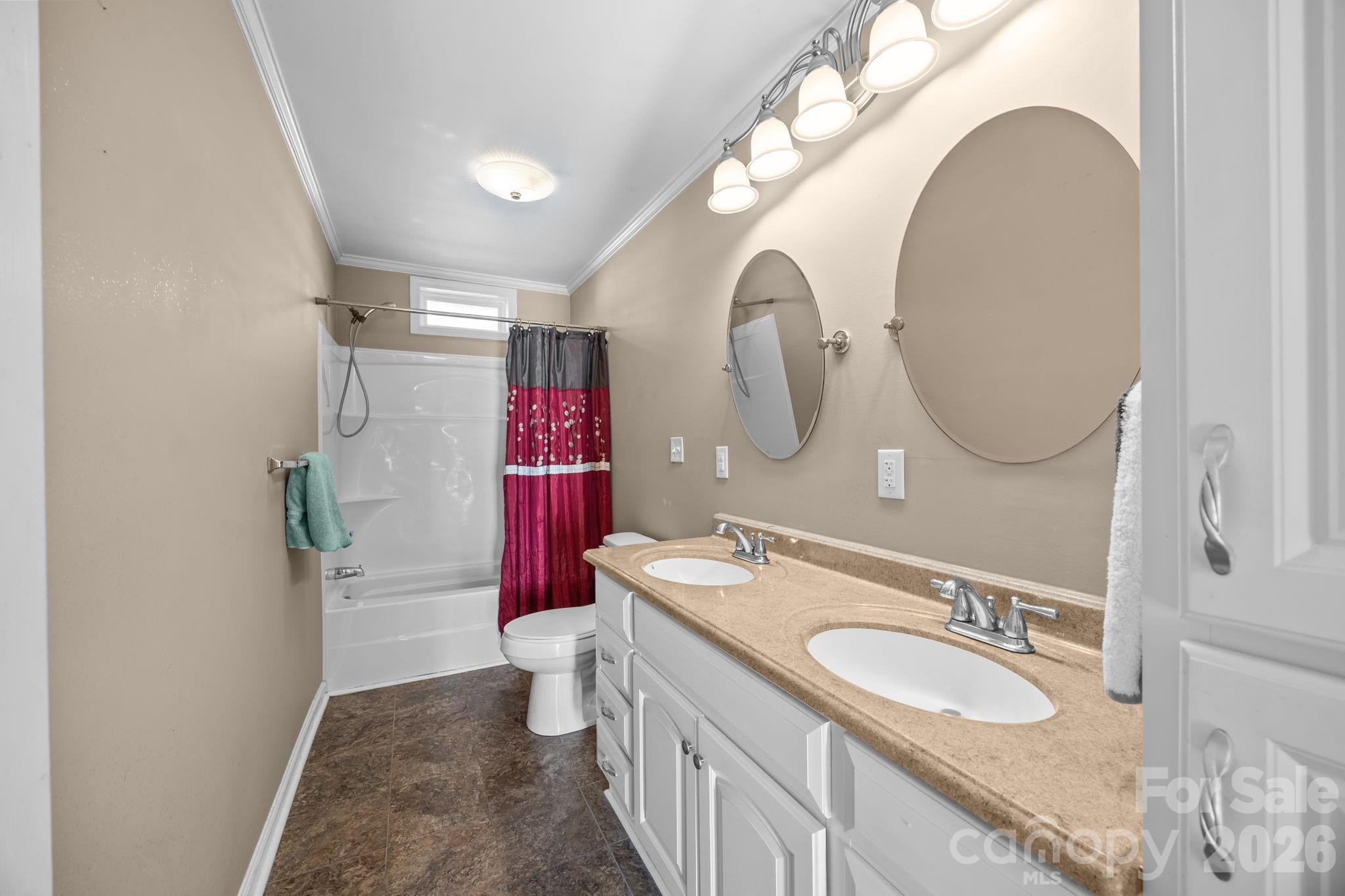 708 Old Charlotte Road Southwest Concord, NC 28027 - Photo 25 of 35 a bathroom with a sink and a mirror