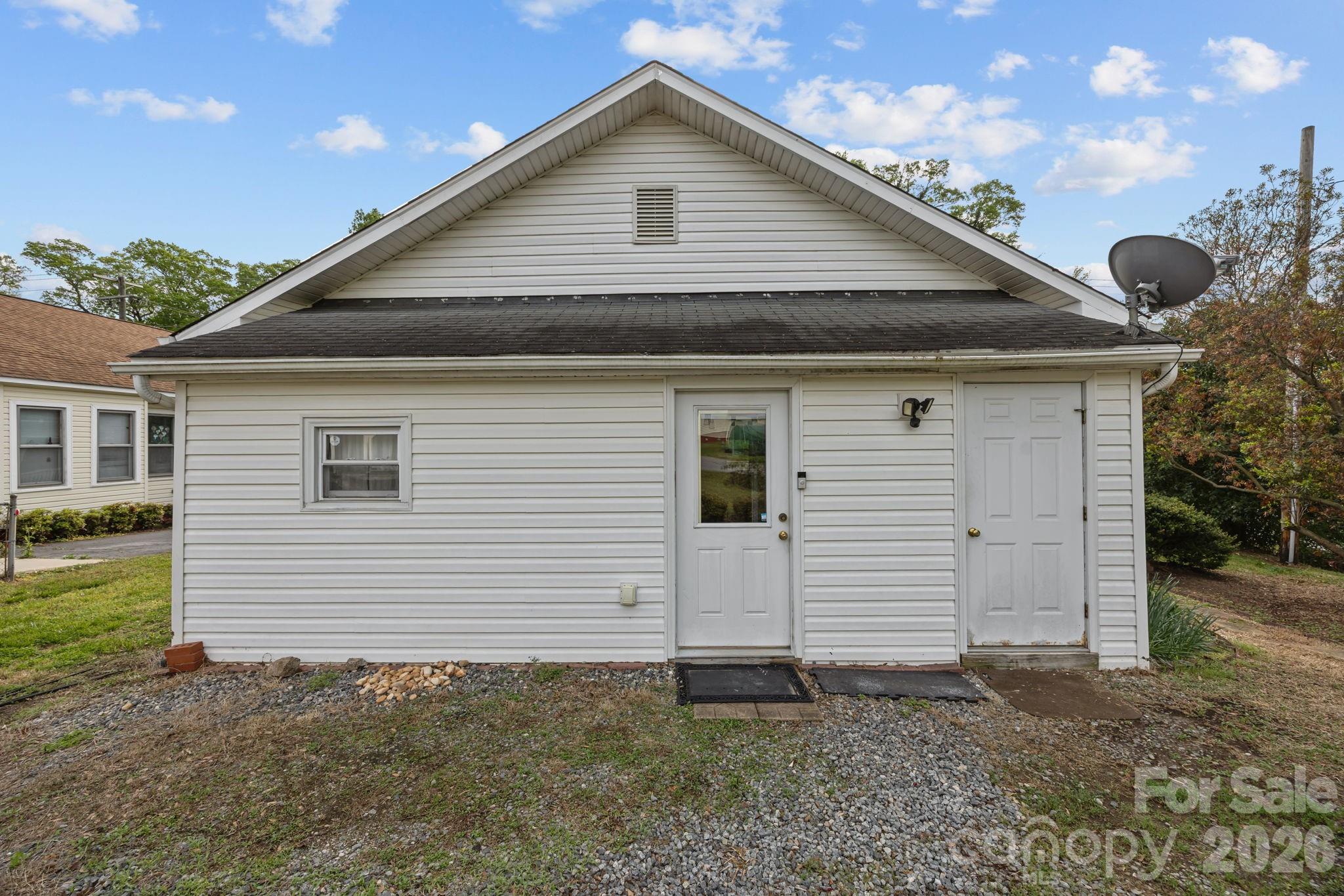 708 Old Charlotte Road Southwest Concord, NC 28027 - Photo 27 of 35 a front view of a house with a yard