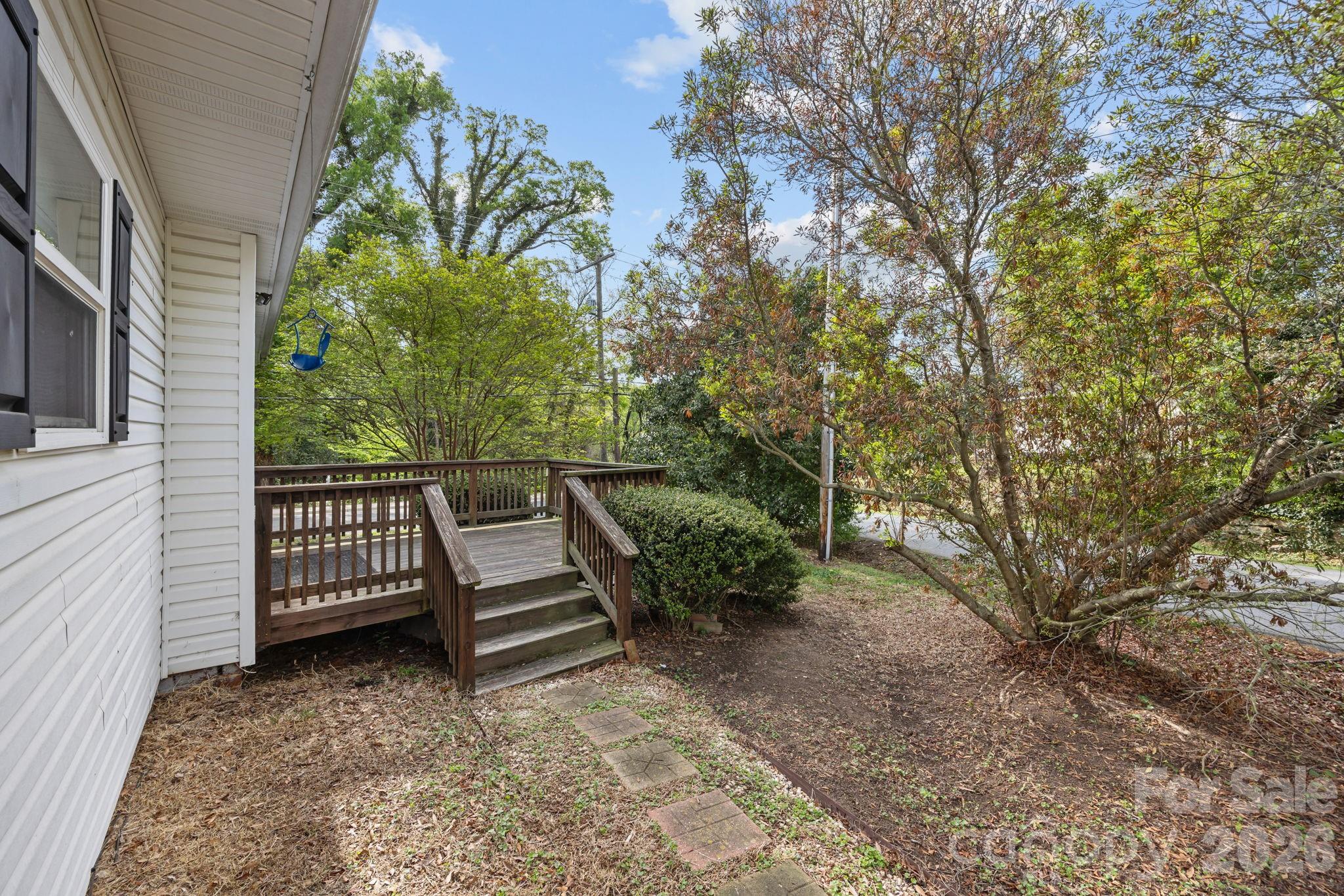 708 Old Charlotte Road Southwest Concord, NC 28027 - Photo 28 of 35 a view of a bench in the backyard