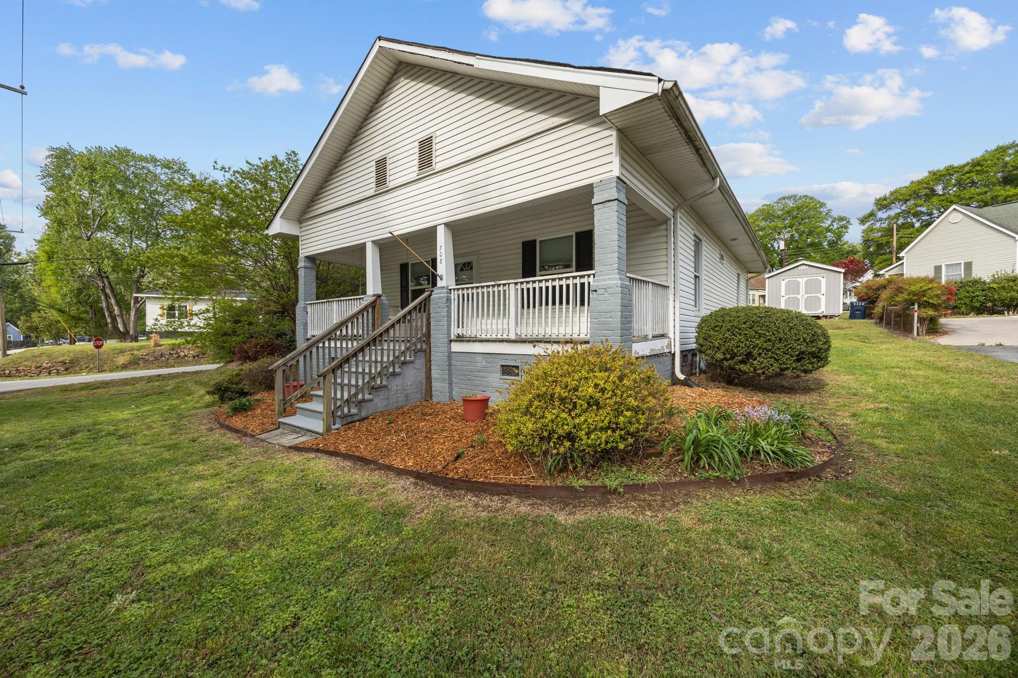 708 Old Charlotte Road Southwest Concord, NC 28027 - Photo 3 of 35 a front view of a house with a yard