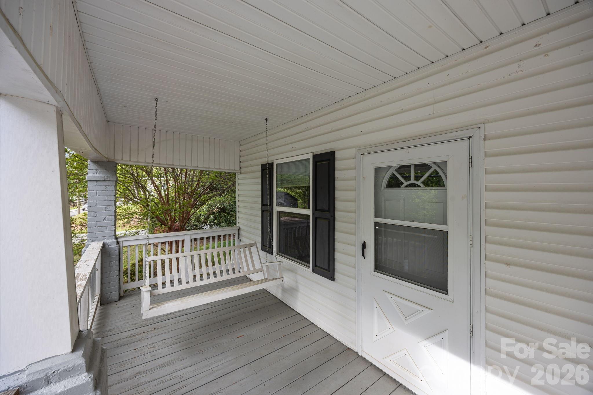 708 Old Charlotte Road Southwest Concord, NC 28027 - Photo 6 of 35 a view of a house with porch and wooden floor