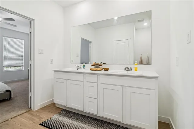 a en suite bathroom with a sink and mirror