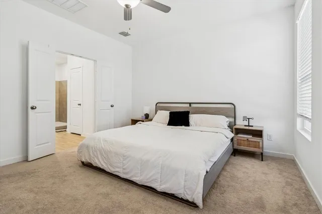 a bedroom with a bed and chair