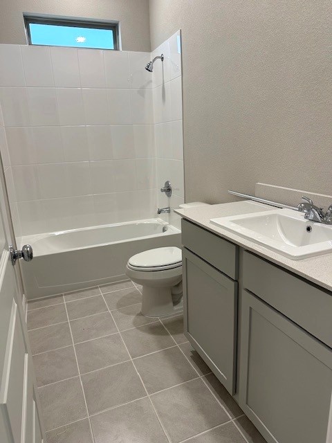 143 Tolo Drive Elgin, TX 78621 - Photo 13 of 30 a bathroom with a sink a toilet and shower