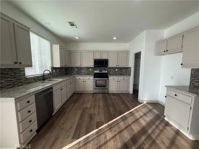 a large kitchen with cabinets