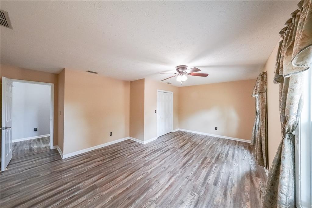 4255 Prestley Mill Road Douglasville, GA 30135 - Photo 25 of 43 a view of empty room with wooden floor
