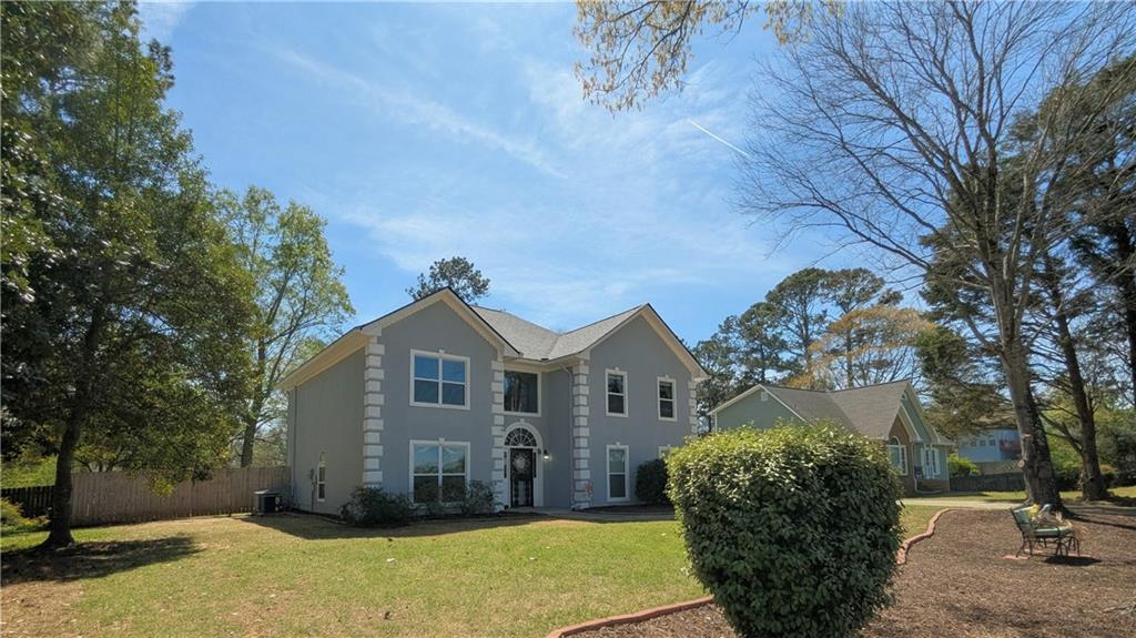 4255 Prestley Mill Road Douglasville, GA 30135 - Photo 3 of 43 a front view of a house with a yard