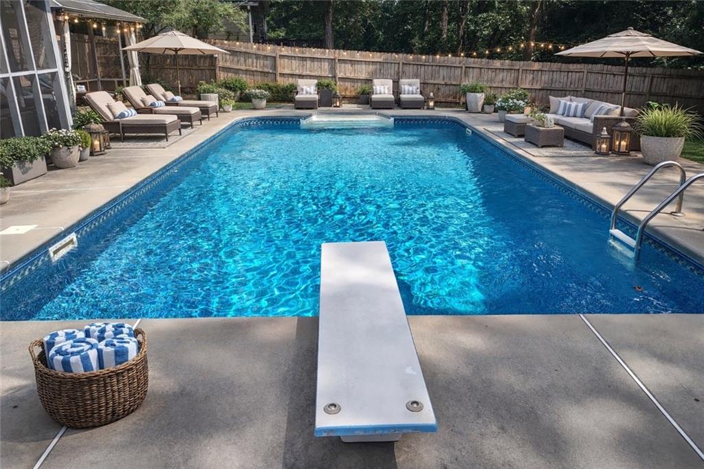 4255 Prestley Mill Road Douglasville, GA 30135 - Photo 40 of 43 a view of swimming pool with outdoor seating and a patio