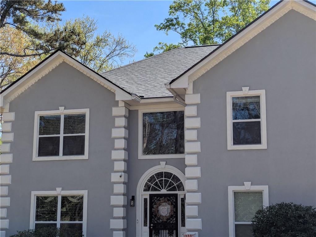 4255 Prestley Mill Road Douglasville, GA 30135 - Photo 4 of 43 a front view of a house with a garden