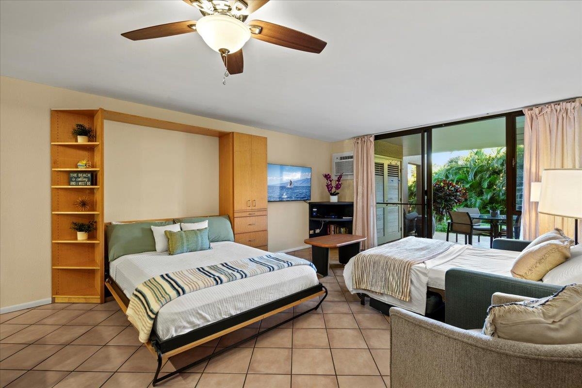 2695 South Kihei Road, Unit 6109 Kihei, HI 96753 - Photo 12 of 49 a bedroom with two beds and a large window
