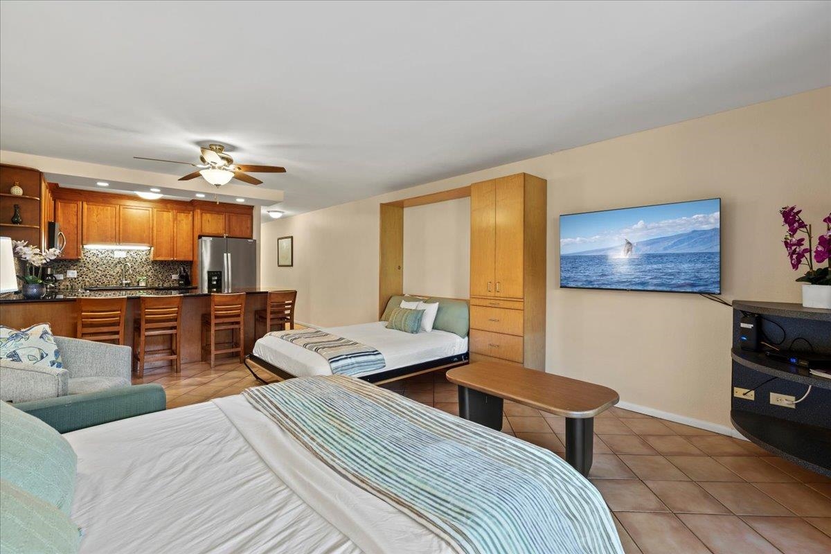 2695 South Kihei Road, Unit 6109 Kihei, HI 96753 - Photo 14 of 49 a bedroom with furniture and a large window