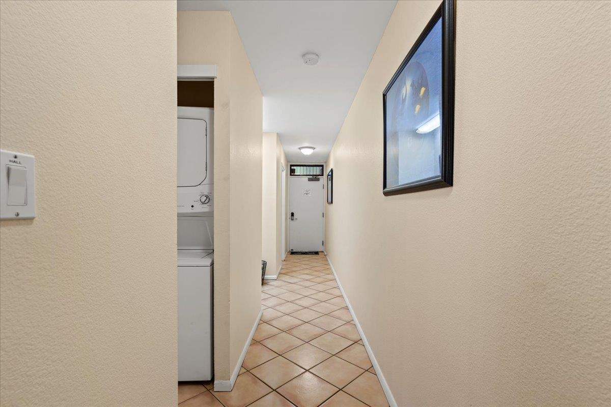 2695 South Kihei Road, Unit 6109 Kihei, HI 96753 - Photo 21 of 49 a view of a hallway with wooden floor and a bathroom