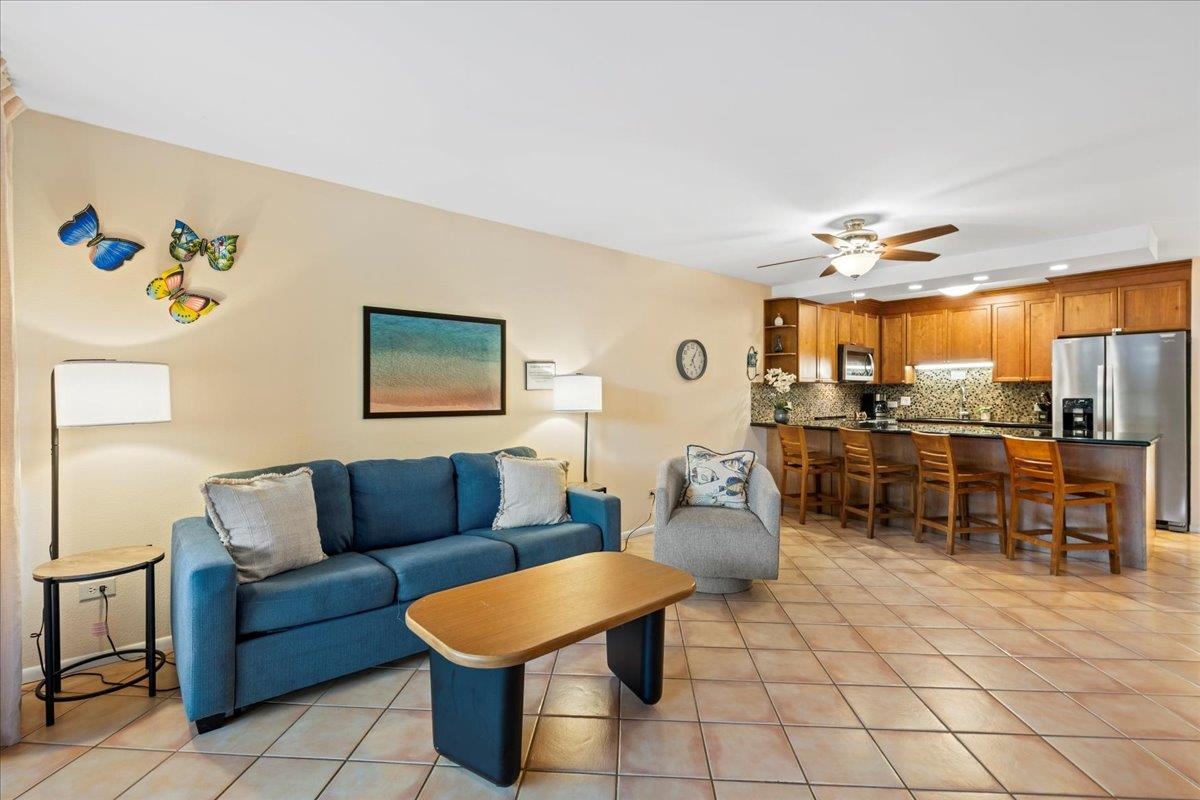 2695 South Kihei Road, Unit 6109 Kihei, HI 96753 - Photo 7 of 49 a living room with furniture and kitchen view