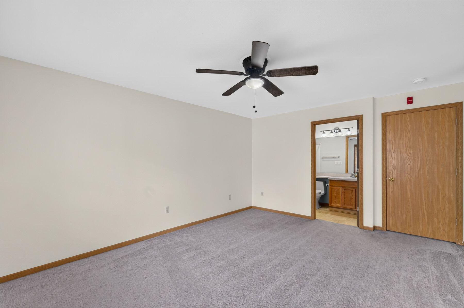 6195 Walnut Lane, Unit 68 Cudahy, WI 53110 - Photo 10 of 20 Primary Bedroom w/ En Suite