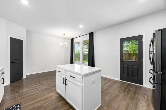 a view of livingroom with hardwood floor and a ceiling fan