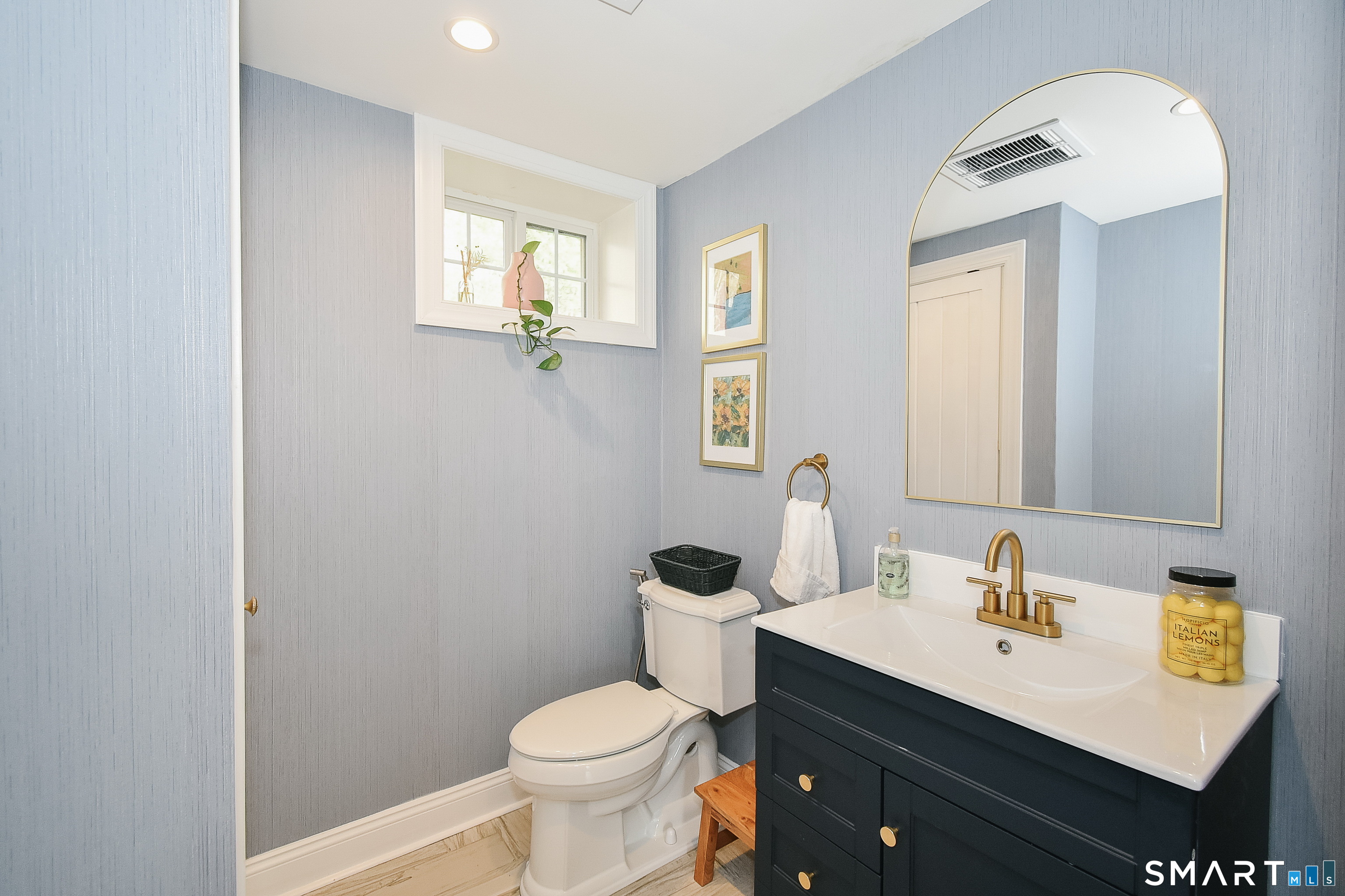 50 1/2 Mountain Spring Road Farmington, CT 06032 - Photo 14 of 28 a bathroom with a sink a toilet and mirror