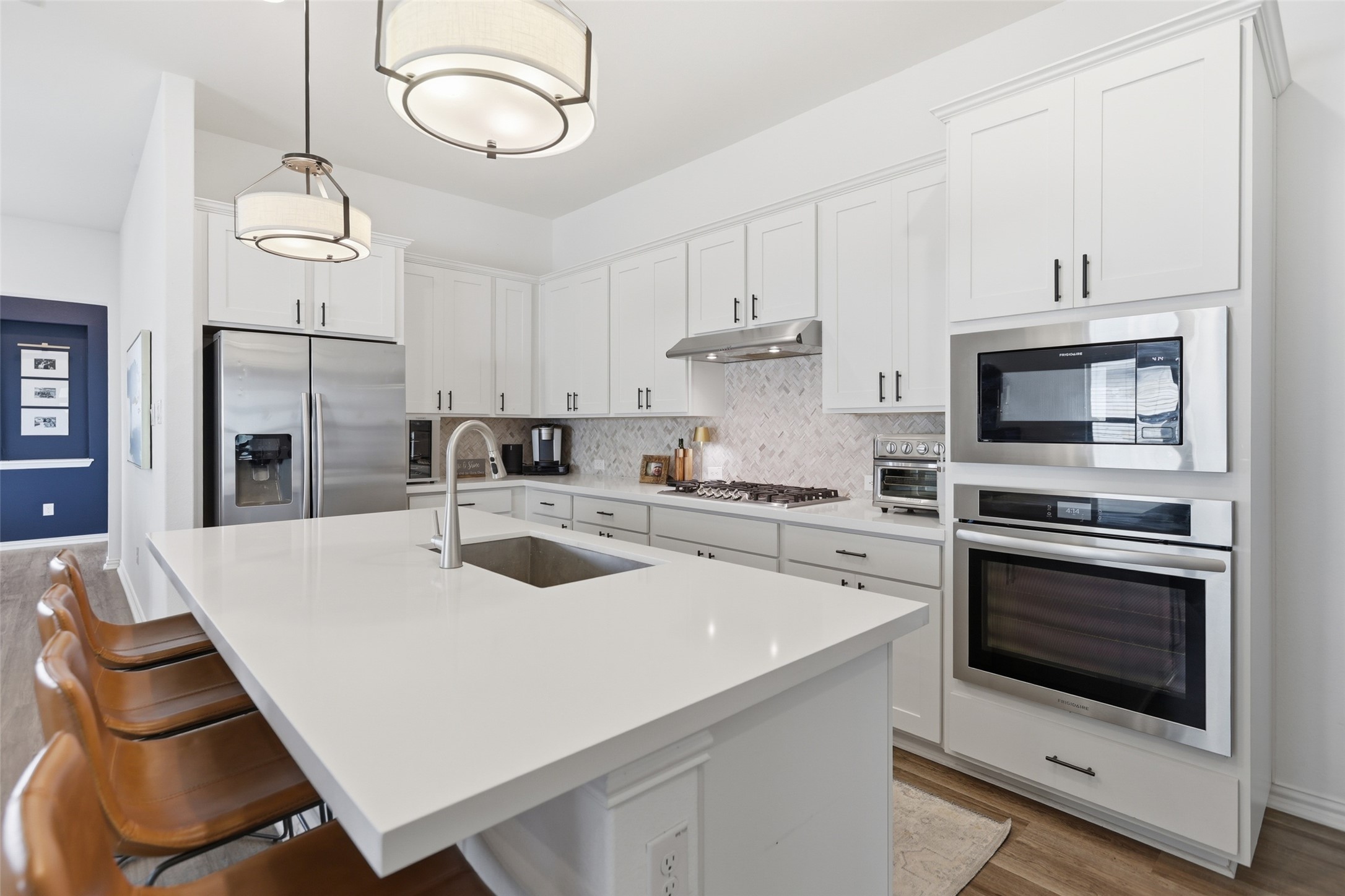 544 Cherrystone Loop Buda, TX 78610 - Photo 10 of 40 a kitchen with a sink cabinets and stainless steel appliances