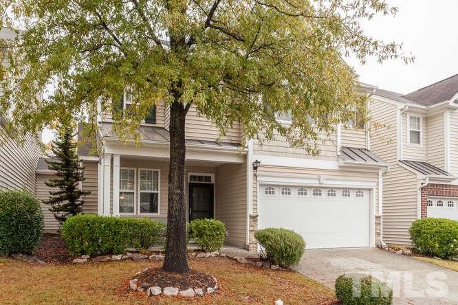 8402 Stoneyard Place Raleigh, NC 27613 - Photo 21 of 25 a front view of a house with garden