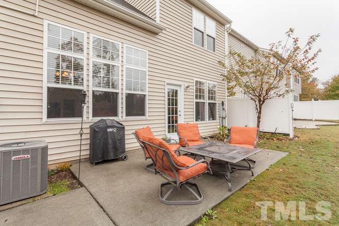 8402 Stoneyard Place Raleigh, NC 27613 - Photo 24 of 25 a backyard of a house with outdoor seating