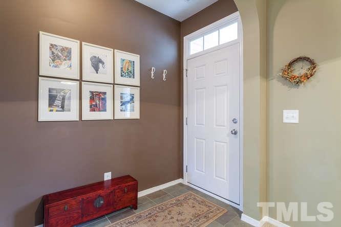 8402 Stoneyard Place Raleigh, NC 27613 - Photo 6 of 25 a view of room with hardwood floor and window