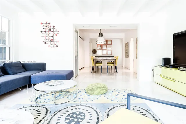 a front view of a house with a yard table and chairs