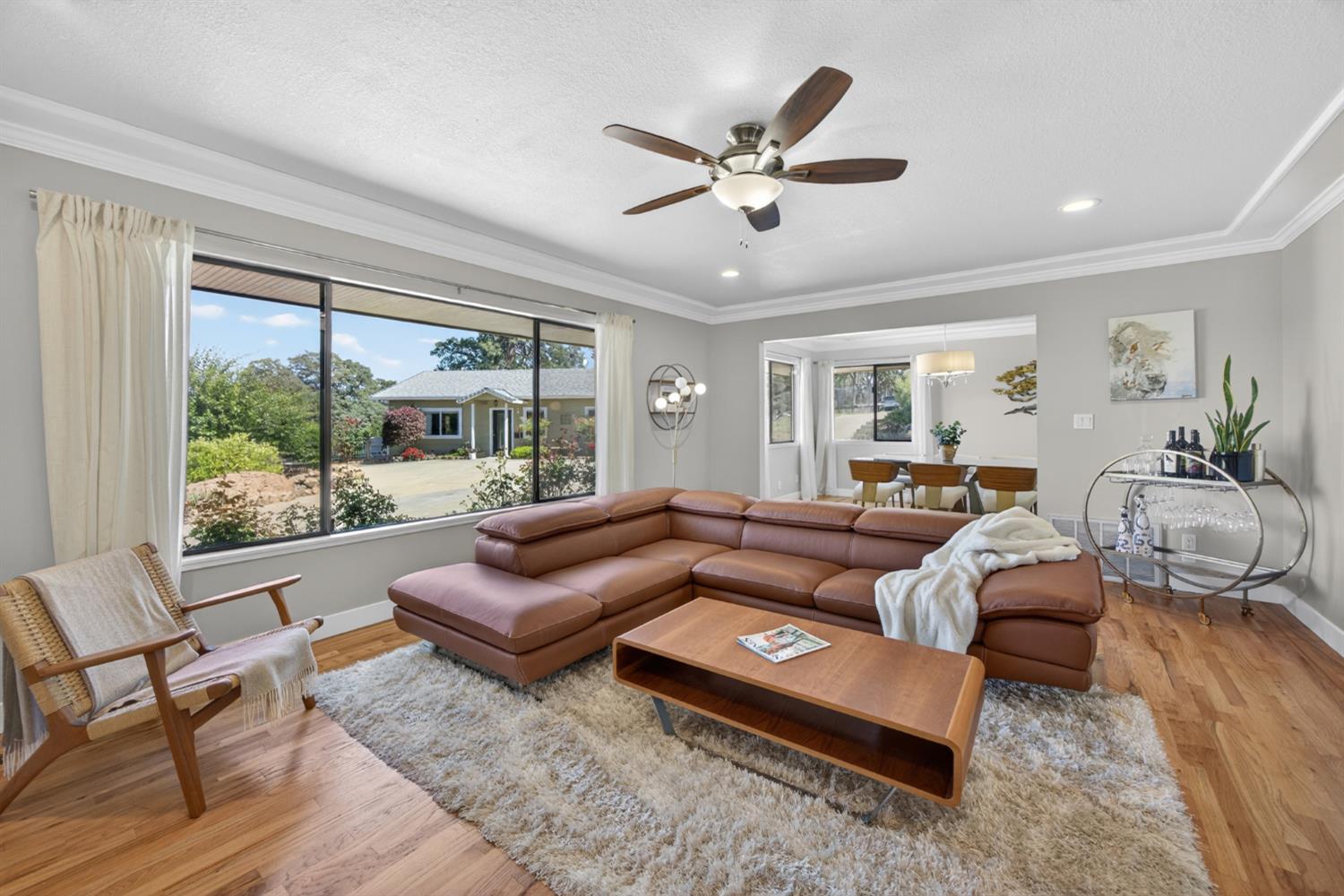 5560 Ralston Way Placerville, CA 95667 - Photo 10 of 78 Spacious living area featuring large picture window and wood flooring.
