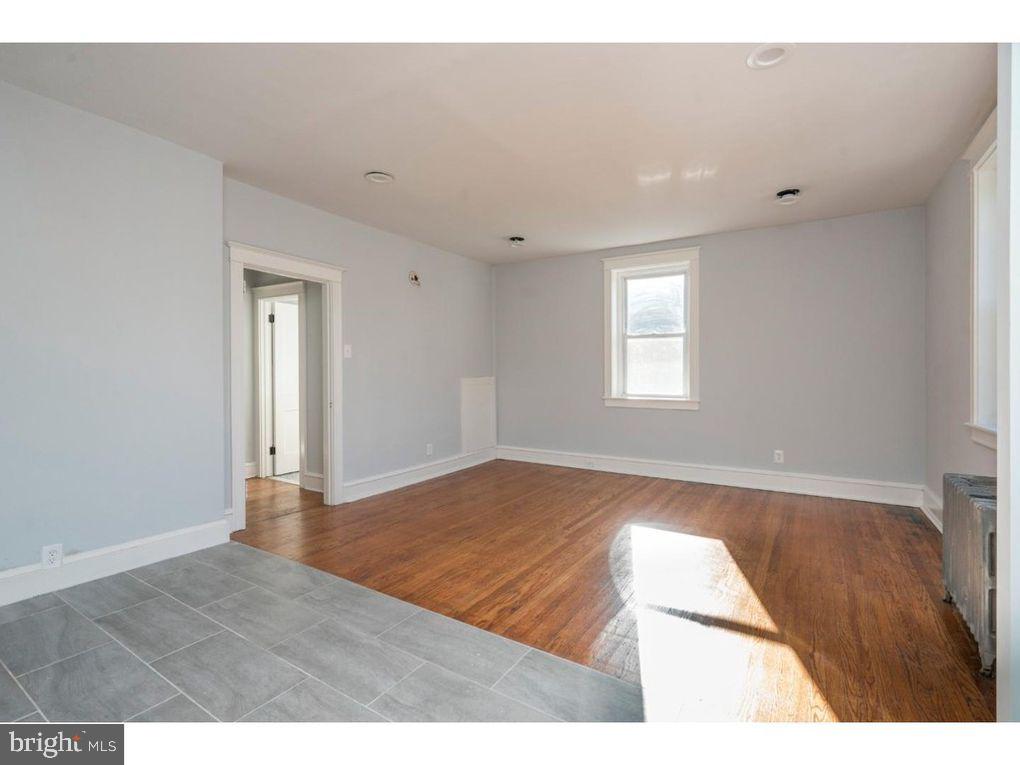 320 Rochelle Avenue, Unit 32 Philadelphia, PA 19128 - Photo 9 of 19 a view of an empty room and window