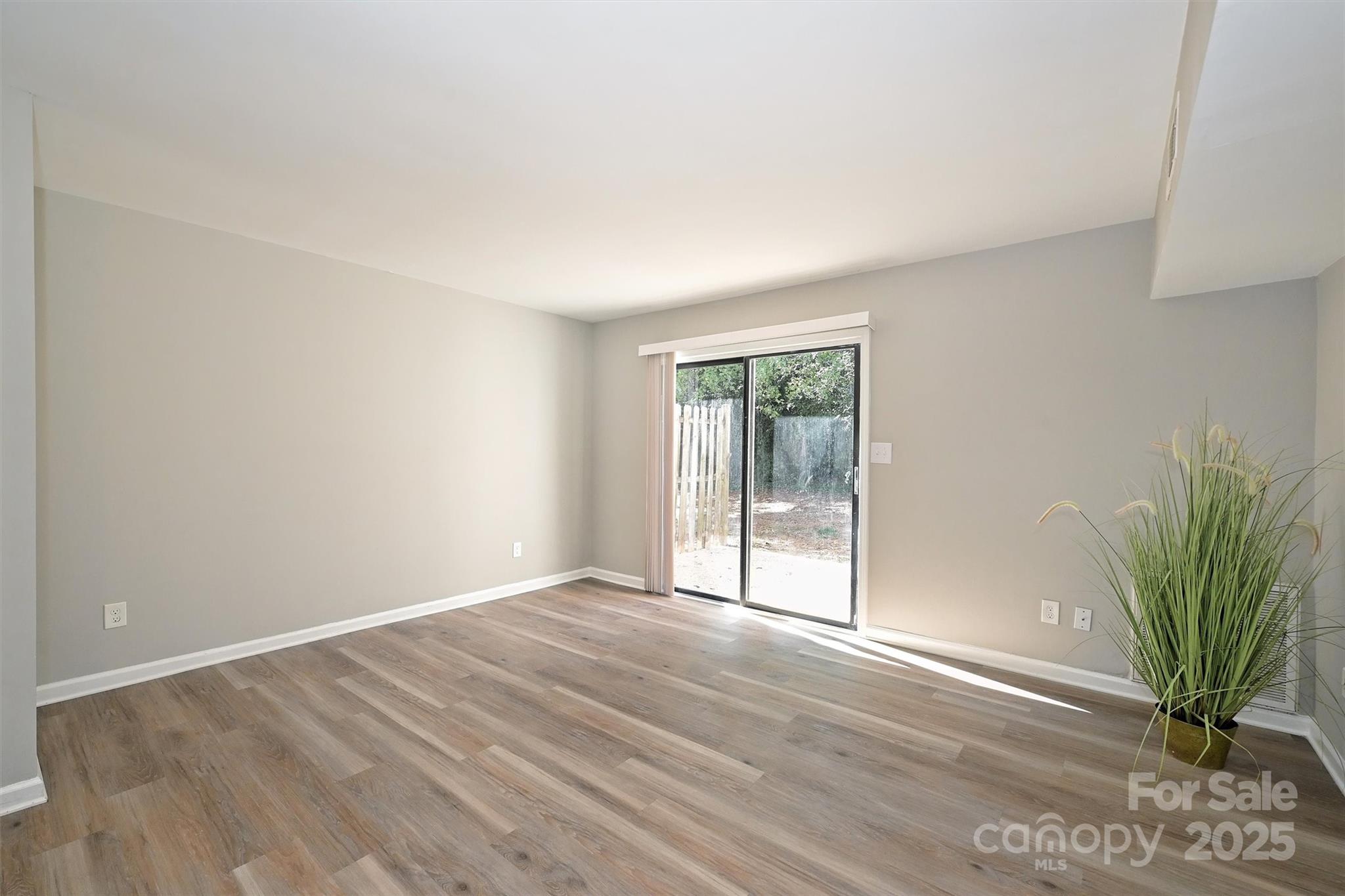 951 Hollywood Street, Unit F Charlotte, NC 28211 - Photo 15 of 42 a view of an empty room with a window