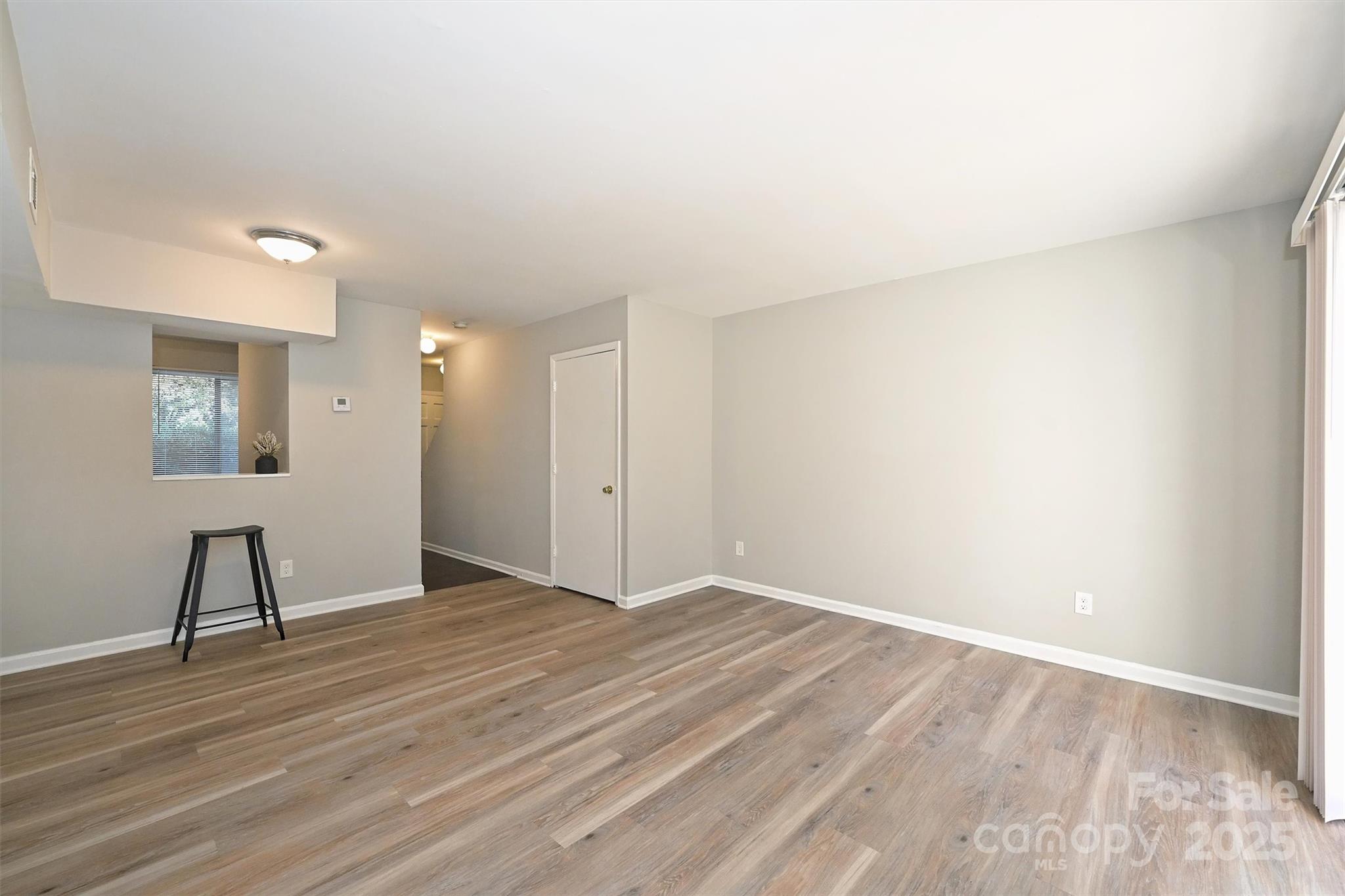 951 Hollywood Street, Unit F Charlotte, NC 28211 - Photo 17 of 42 a view of an empty room and wooden floor