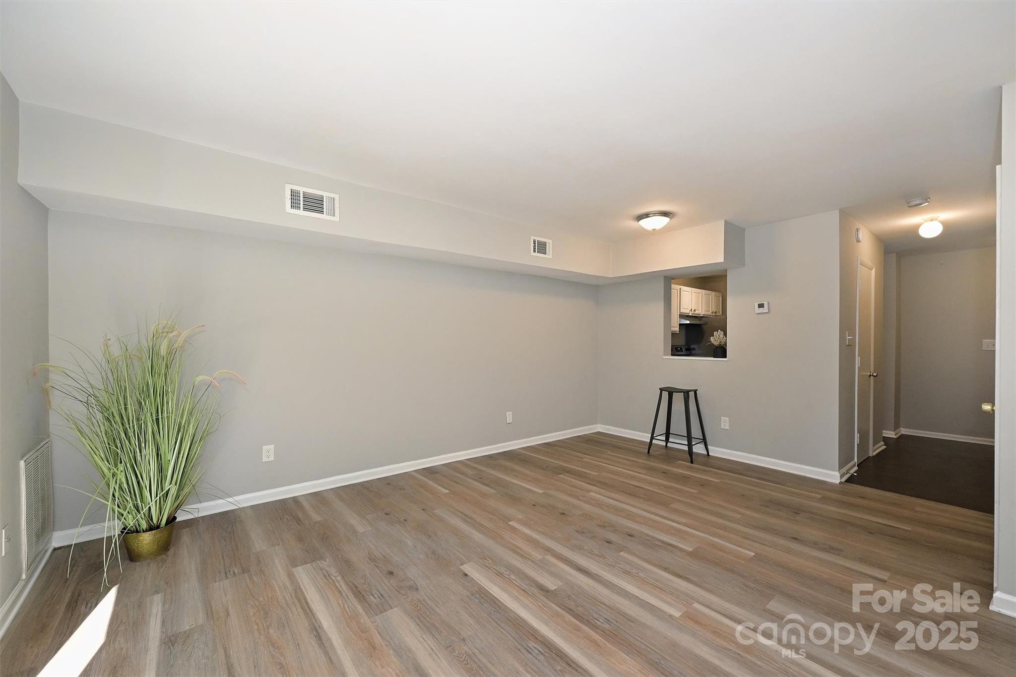 951 Hollywood Street, Unit F Charlotte, NC 28211 - Photo 19 of 42 a view of empty room with wooden floor