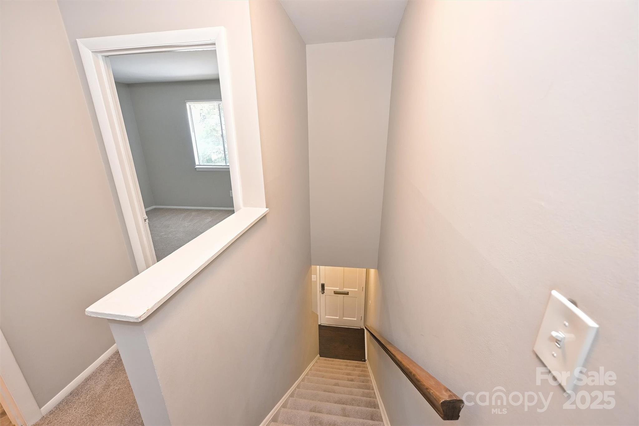 951 Hollywood Street, Unit F Charlotte, NC 28211 - Photo 23 of 42 a bathroom with a toilet and a wooden floor