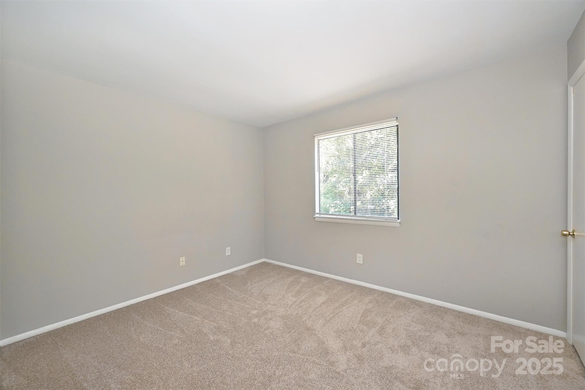 951 Hollywood Street, Unit F Charlotte, NC 28211 - Photo 24 of 42 an empty room with a window