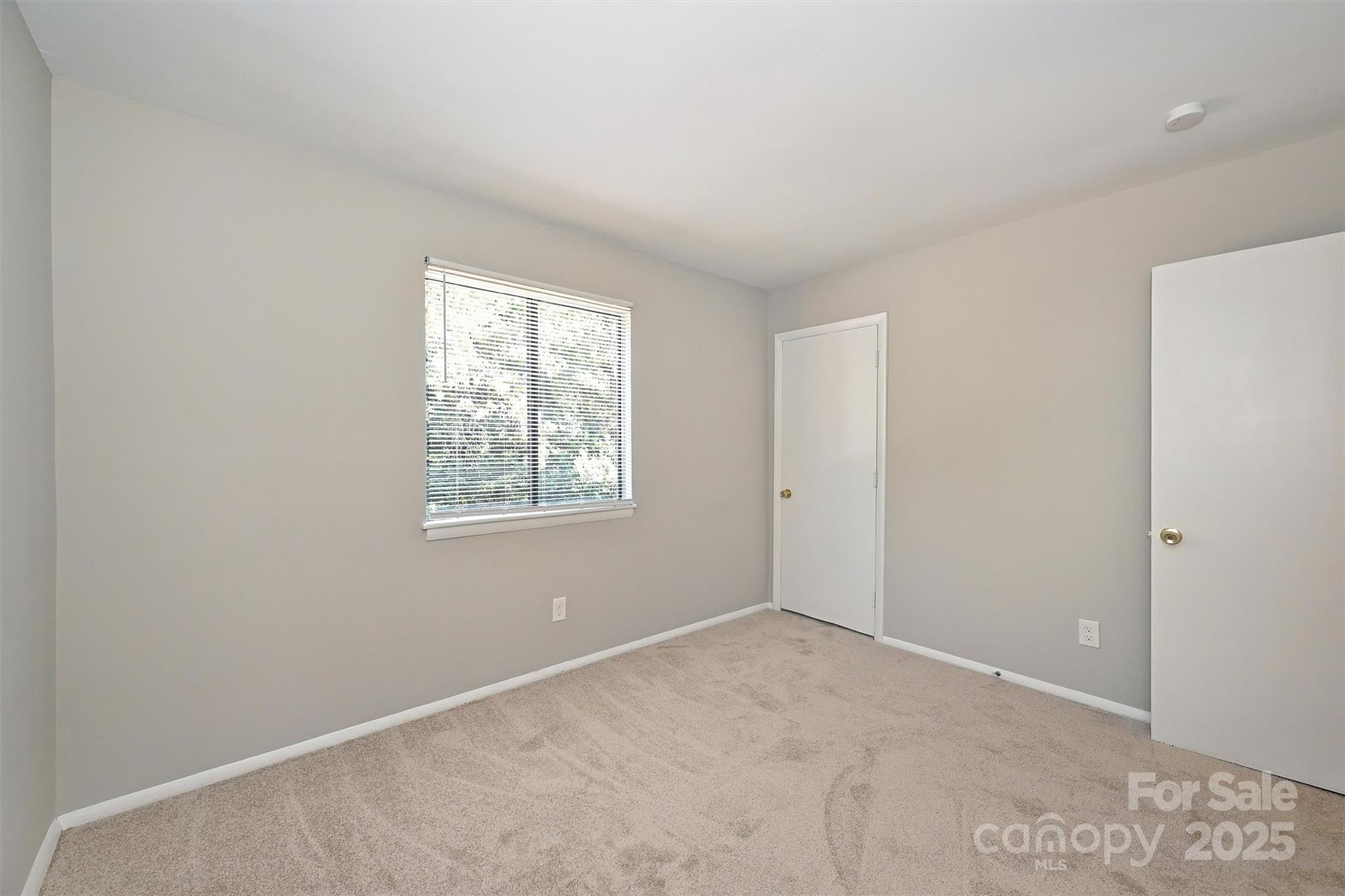 951 Hollywood Street, Unit F Charlotte, NC 28211 - Photo 25 of 42 an empty room with windows