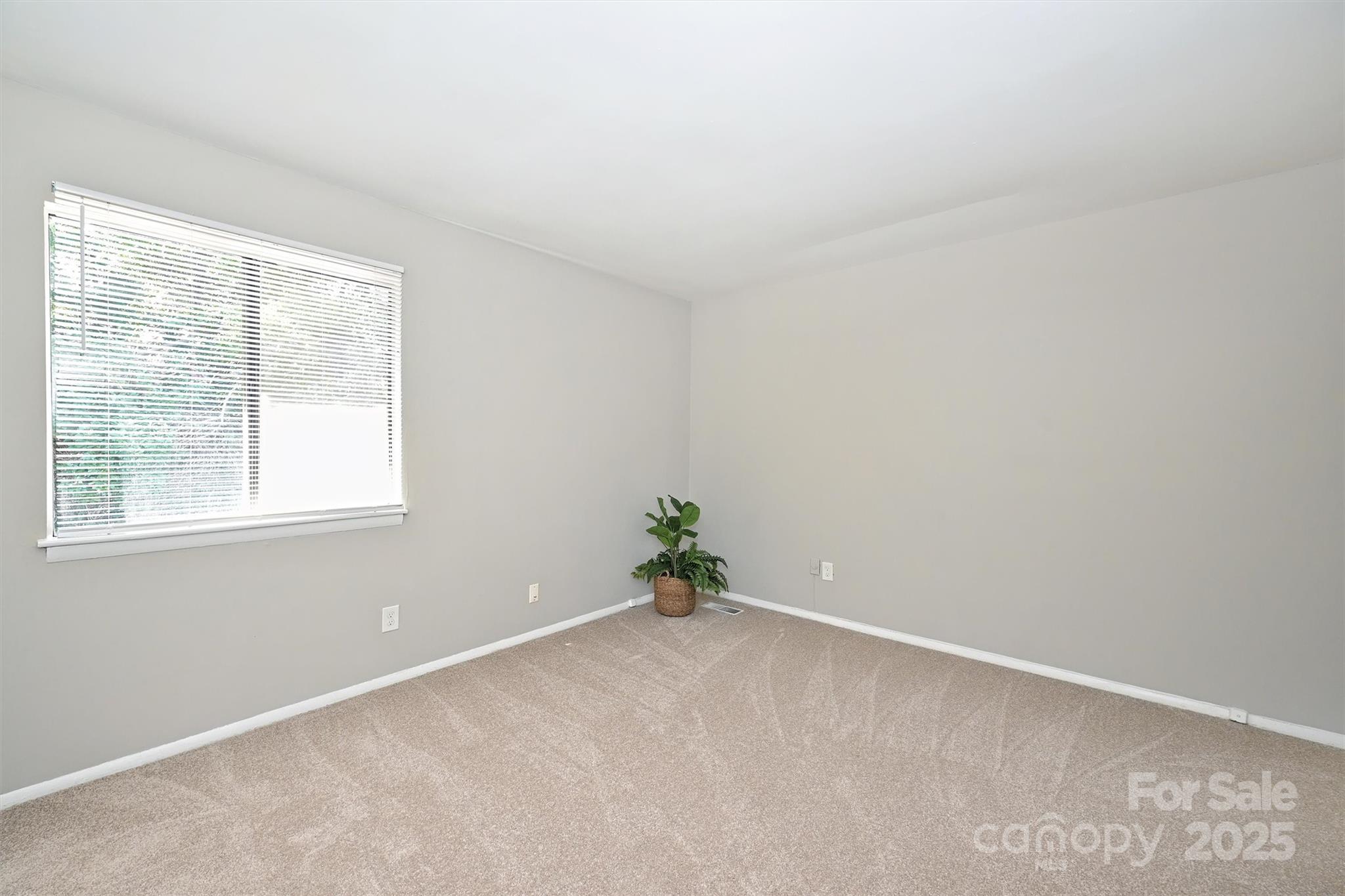 951 Hollywood Street, Unit F Charlotte, NC 28211 - Photo 26 of 42 an empty room with a window