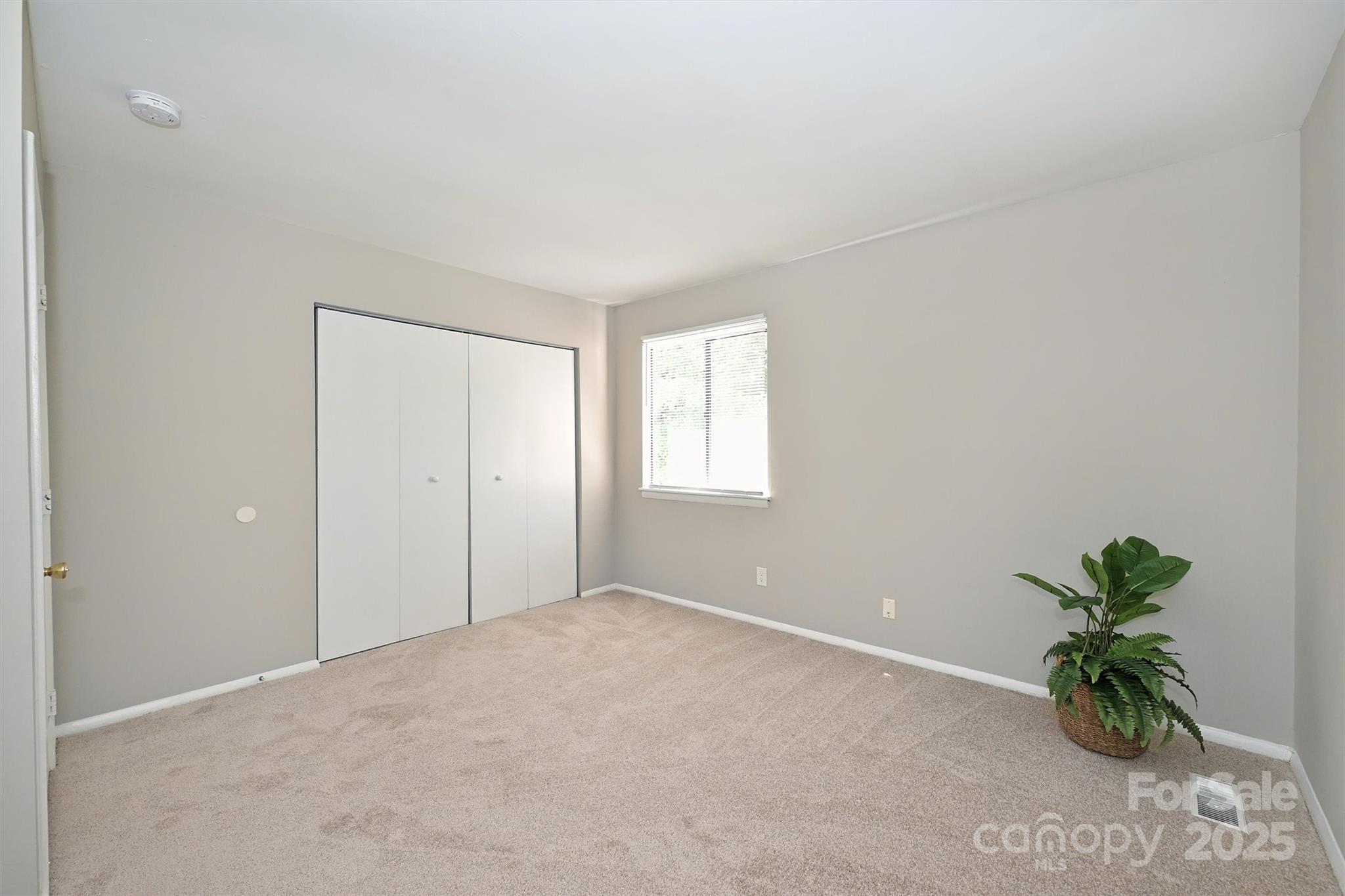 951 Hollywood Street, Unit F Charlotte, NC 28211 - Photo 27 of 42 a view of an empty room with a window