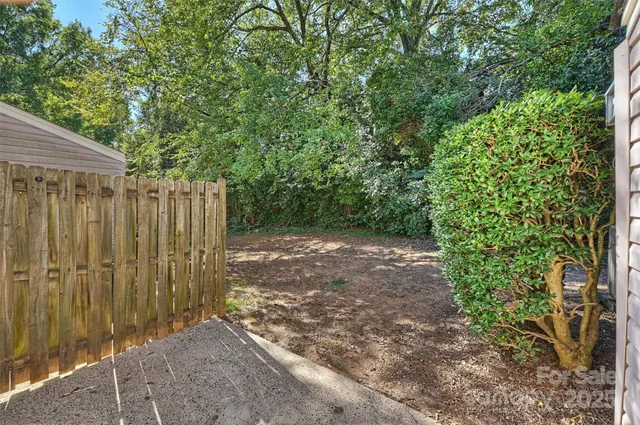 a view of a backyard with pathway