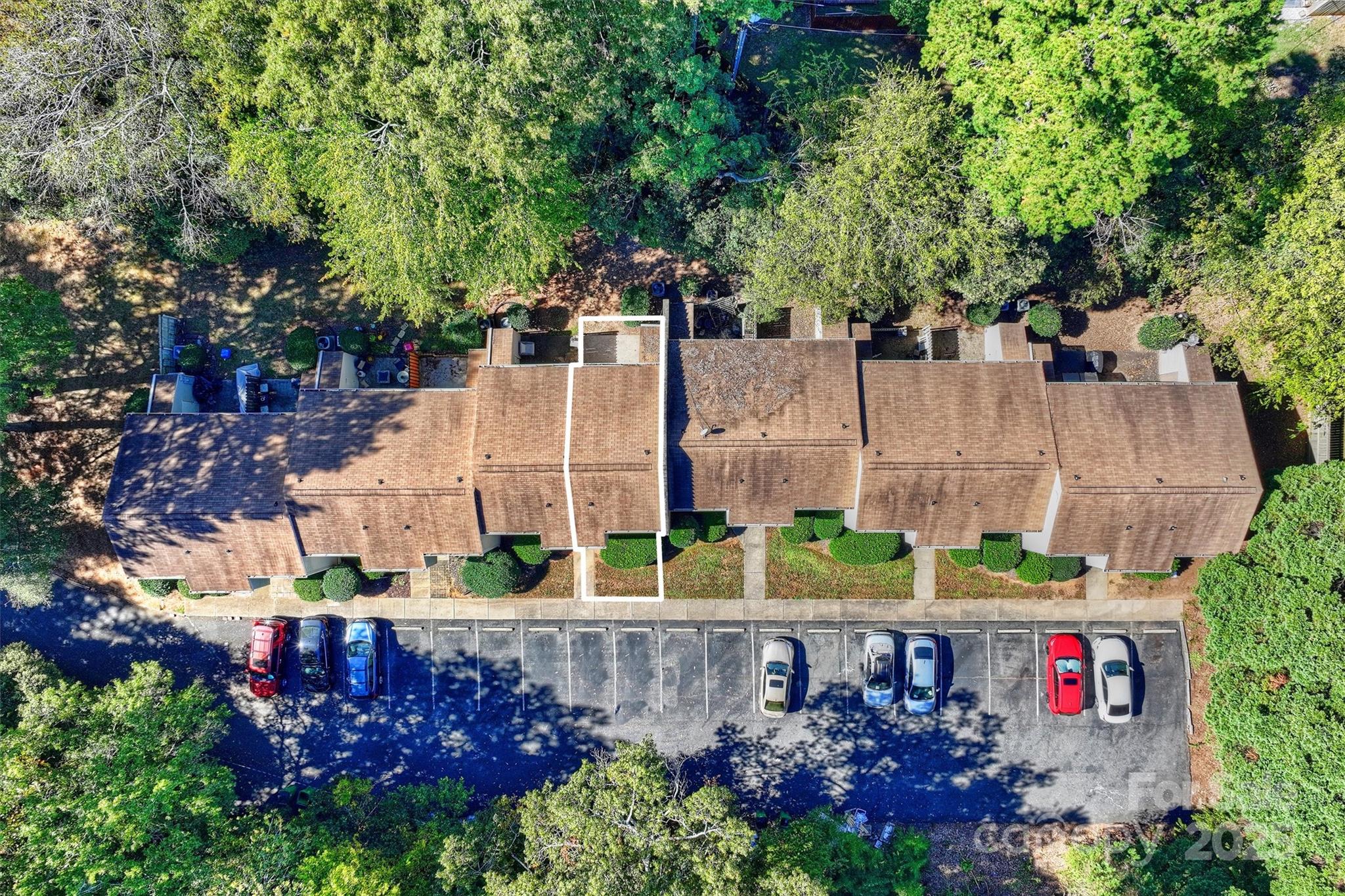 951 Hollywood Street, Unit F Charlotte, NC 28211 - Photo 38 of 42 an outdoor space with lots of green space and parked cars