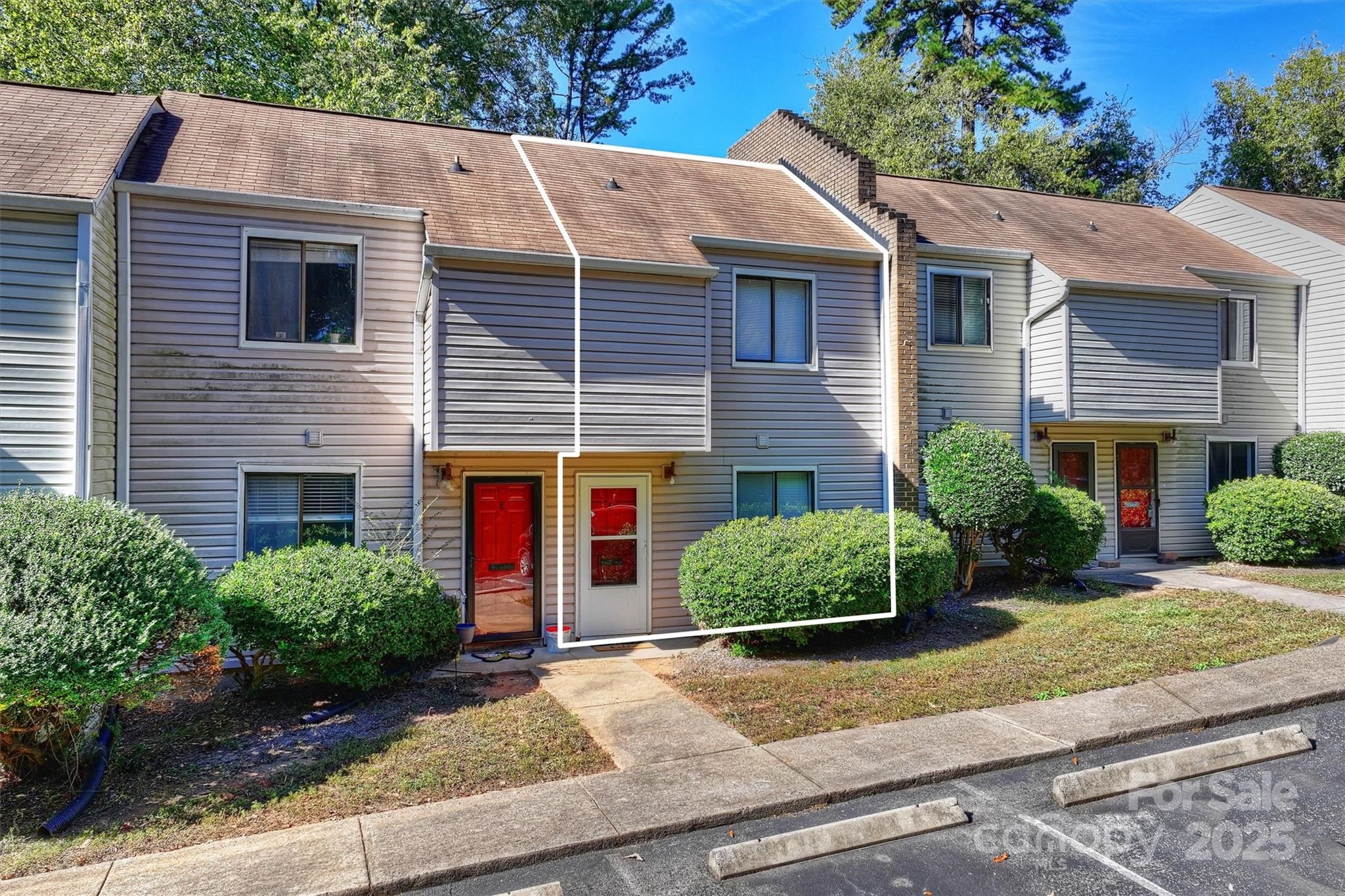 951 Hollywood Street, Unit F Charlotte, NC 28211 - Photo 6 of 42 a front view of a house with a yard and garage