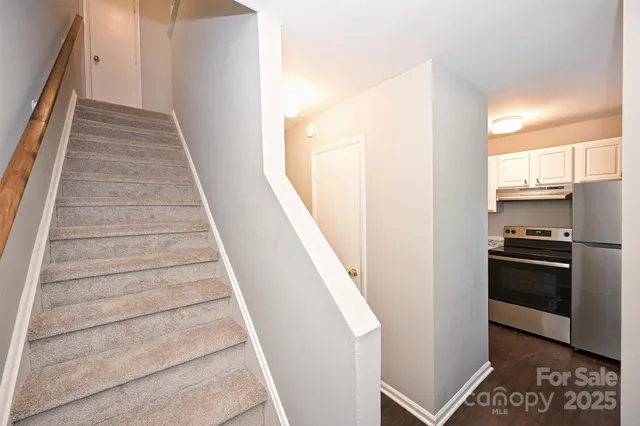 a view of a kitchen with appliances and cabinets