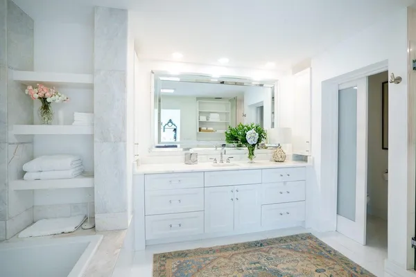 a bathroom with a sink a toilet and a vanity