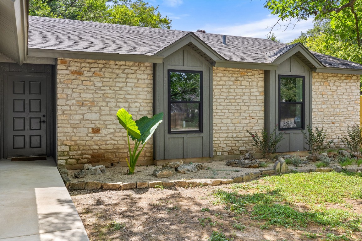 12604 Tree Line Drive Austin, TX 78729 - Photo 1 of 1 a front view of a house with garden