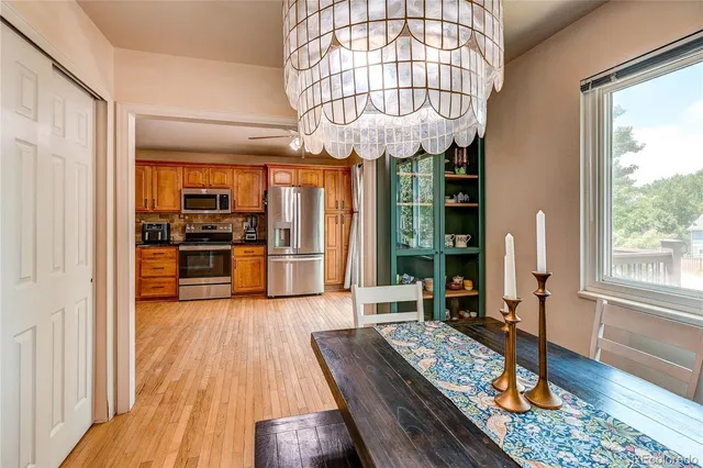 a very nice looking room with wooden floor and furniture